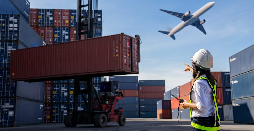 Foreman control loading Containers box to truck for Logistic Import Export Background, Business logistic concept, import and export concept.